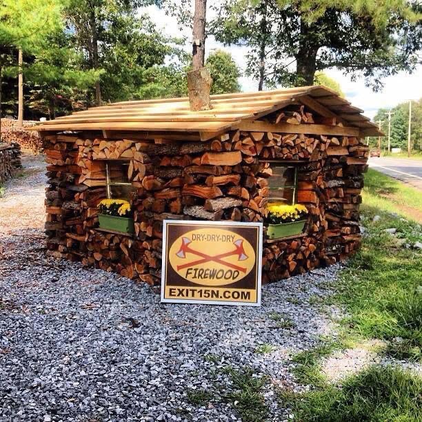 The Exit 15N firewood hut, surrounded by trees at our local yard
